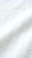 Close-up of white linen fabric with diagonal weave texture, suitable for textile, fashion, interior design, and home decor projects.