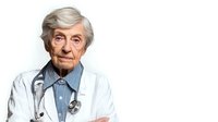 Senior male doctor with gray hair and stethoscope in white coat on isolated background for medical healthcare design concepts.