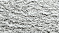 White textured paper surface with natural fiber patterns and rough organic texture for backgrounds and design projects.