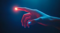 Glowing human hand reaching out against dark background with dramatic red and blue lighting effect creates futuristic technological mood for creative design projects.