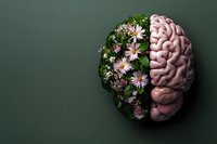 Human brain split with blooming flowers and green leaves on dark background, representing mental health, mindfulness and natural healing concept.