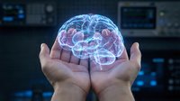 Hands holding glowing digital brain hologram with neural networks in futuristic medical technology laboratory for healthcare innovation and AI research.