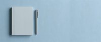 Blank notebook with pen on light blue background, flat lay composition for branding, stationery design, business mockup, and creative projects.