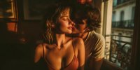 Young couple sharing intimate romantic moment in warm golden light embracing passionately in cozy apartment setting for relationship and love concepts.