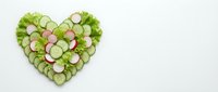 Fresh cucumber and radish slices arranged in heart shape on white background, representing healthy eating, vegetarian nutrition, and wholesome food choices.