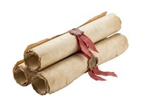 Rolled parchment scrolls tied with burgundy ribbons, isolated on white background. Suitable for diploma, certificate, achievement, education, and vintage design projects.