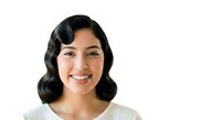 Young woman with dark wavy hair and warm smile wearing casual white top, isolated on white background for portrait, headshot, and professional use.