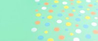 Colorful oval shapes scattered on mint green background creating playful confetti pattern for party decorations and celebration designs.