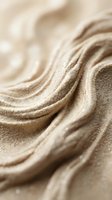 Smooth sand waves with soft focus creating flowing patterns and textures, suitable for backgrounds, wellness, spa, and nature-themed designs.
