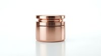 Copper measuring cups set stacked together on white background isolated for kitchen cooking and baking design projects.