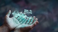 Young adult male hand holding glowing digital sound wave with noise reduction technology text overlay, representing audio engineering, signal processing, and acoustic innovation for tech applications.