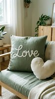 Cozy living room chair with sage green love pillow and heart cushion, natural wood furniture and houseplants in bright Scandinavian interior.