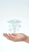 Hand holding medical caduceus symbol with wireless connectivity and technology icons, representing digital healthcare, telemedicine, and modern medical services for web and app design.