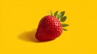 Fresh ripe strawberry with green leaves on bright yellow background. Healthy organic fruit for summer recipes, smoothies and desserts.