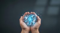 Hands holding glowing digital brain with network connections representing artificial intelligence, machine learning and neural technology innovation.