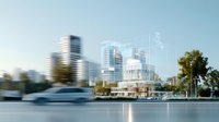 Modern urban architecture concept with transparent glass buildings and city skyline against blue sky, showcasing contemporary metropolitan development.