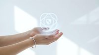 Cupped hands presenting glowing heart icon with protective circles symbolizing healthcare, wellness, love and care concepts for medical design.