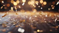 Falling on dark wooden surface with bokeh lights creating magical festive atmosphere. Celebration background with soft focus effect.