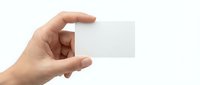 Hand holding blank white business card mockup on clean background for branding and corporate identity design projects.