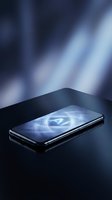 Smartphone with glowing AI symbol on screen against dark blue abstract background with light rays, representing artificial intelligence technology and digital innovation.