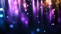 Abstract purple and blue bokeh lights with sparkling particles and glowing effects creating magical atmosphere for celebrations and festive events.