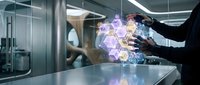 Businessman in suit interacting with glowing purple holographic data visualization and digital network interface on table in modern office environment for technology and innovation concepts.