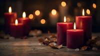 Red candles burning with warm flames create cozy atmosphere on wooden surface with autumn leaves and soft bokeh lights for seasonal decoration.