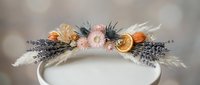 Elegant floral crown with dried flowers, pampas grass and lavender on neutral background for wedding photography and bridal accessories design.
