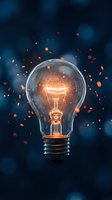 Glowing incandescent bulb with illuminated filament emitting warm orange light and sparks against dark blue background, symbolizing innovation and creative ideas.