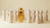 Golden figure standing out among wooden people representing leadership, uniqueness and business success concepts for corporate presentations.
