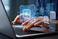 Businessman hands typing on laptop with holographic CPU processor and digital data interfaces for technology and computing concepts.