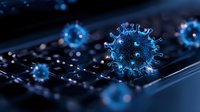 Glowing blue virus cells floating over computer circuit board in dark background, representing cyber security and digital health threats in technology.