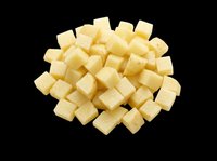 Diced cheese cubes isolated on transparent background, ready for culinary design, food packaging, recipe graphics, cooking blogs, restaurant menus, and print-on-demand food illustrations.
