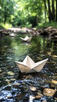 Paper boats floating on forest stream water with stones and green trees in background, creating magical childhood atmosphere for nature and adventure concepts.