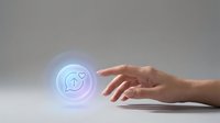Hand hovering over glowing neon circle with peace symbol icon, representing spirituality, wellness, and mindfulness concepts for meditation and healing applications.