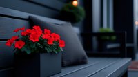 Red roses in modern square planter on contemporary outdoor patio furniture creating elegant evening ambiance for home decor and landscape design.