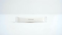 Single white sugar packet with text label on neutral background, suitable for food packaging, culinary, restaurant, cafe, and hospitality design projects.