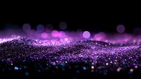 Magical purple glitter particles with bokeh effect on black background, shimmering wave of sparkling dust creates dreamy atmosphere for festive designs.