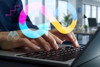 Business professional typing on laptop with colorful digital chain links representing blockchain technology and connectivity in modern office.