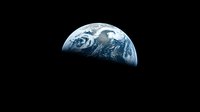 Half view of planet Earth from space showing blue oceans, white clouds and continents against black cosmic background, dramatic environmental concept.
