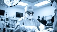 Surgeon performing operation in modern operating room with medical team and advanced equipment for healthcare and surgical procedures.