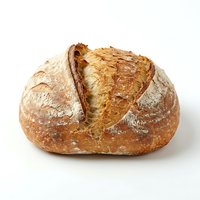 Freshly baked artisan sourdough loaf with crispy golden crust and deep score marks, isolated on white background for bakery, food, and culinary design use.