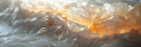 Dramatic mountain landscape with golden sunlight breaking through clouds over snow-capped peaks creating ethereal atmosphere for outdoor adventure content.