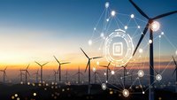 Smart wind turbines with digital network connections at sunset showcasing renewable energy technology and IoT integration for sustainable power generation.