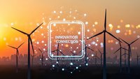Wind turbines at sunset with digital innovation network overlay and glowing connection points representing renewable energy technology advancement.