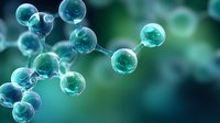Molecular structure visualization in turquoise blue tones against blurred dark background shows connected spherical atoms forming chemical compound model.