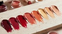 Lipstick color swatches on neutral background showing red to nude shades palette for beauty and cosmetics testing applications.