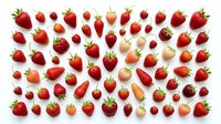 Fresh red strawberries and raspberries isolated on white background, arranged flat lay pattern for food, nutrition, healthy eating, and culinary design projects.