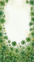 Watercolor clover border frame with four-leaf shamrocks and tiny wildflowers, soft green tones, copy space center for text or greeting cards.