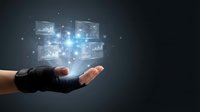 Hand holding glowing digital network interface with connected data screens and light particles, representing cloud computing, data management, and technology innovation.